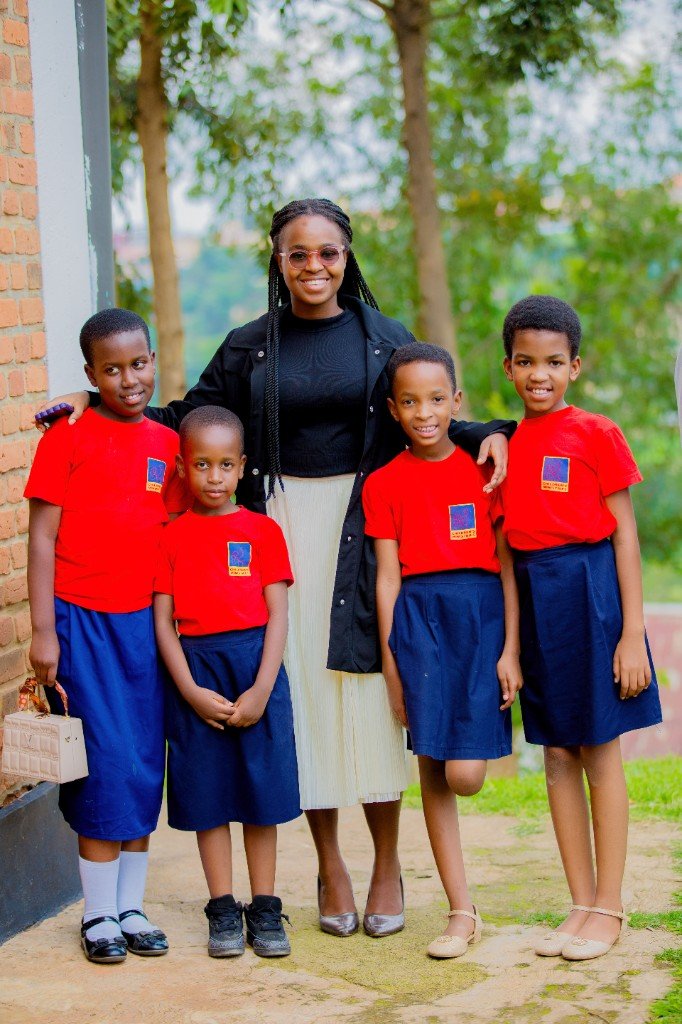 Children's Ministry leader with children in Sabbath School uniforms